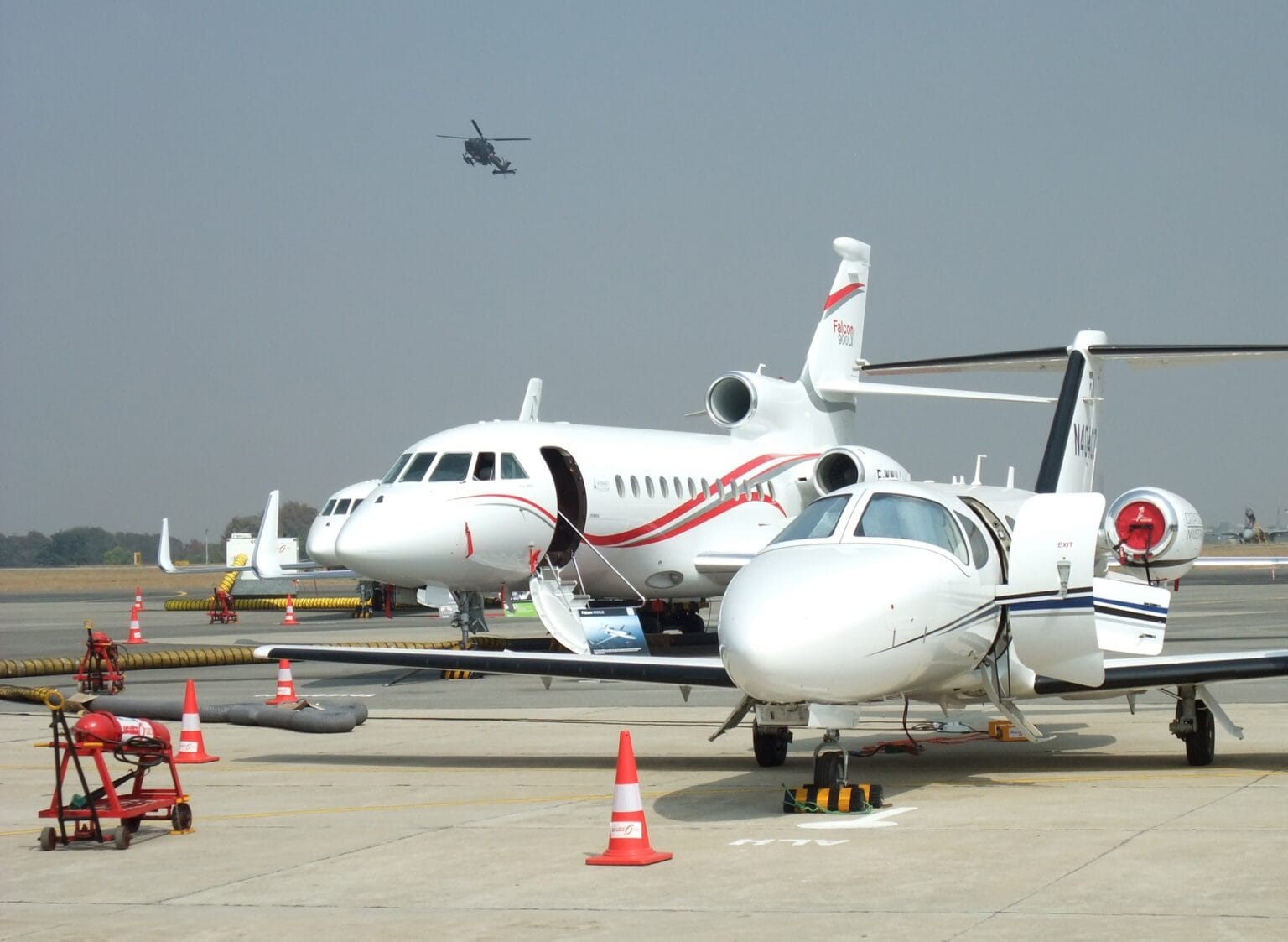 London Luton Airport (LTN / EGGW): several private jets parked on an airport ramp