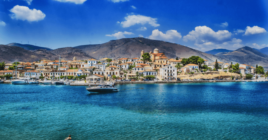 Zakynthos International Airport (ZTH / LGZA): scenic harbor and waterfront town in Greece with mountains in the background