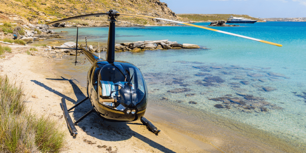 Elefsis Air Base (LGEL): helicopter parked near a turquoise beach in Greece