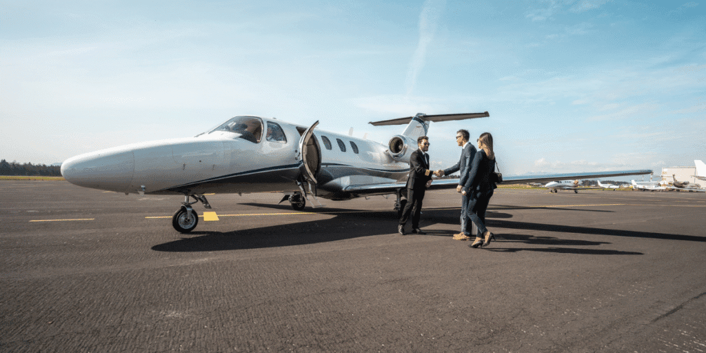 Guanacaste Airport (LIR / MRLB): private jet parked on an airport ramp with passengers nearby