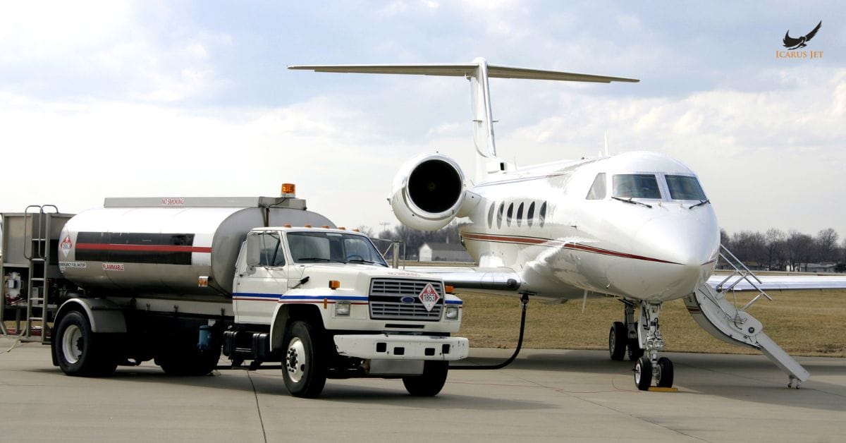 Private jet refueling service with fuel truck at airport apron