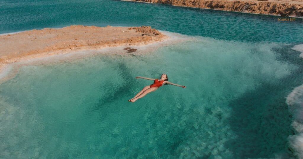 woman floating in salt lake in Siwa Oasis Egypt
