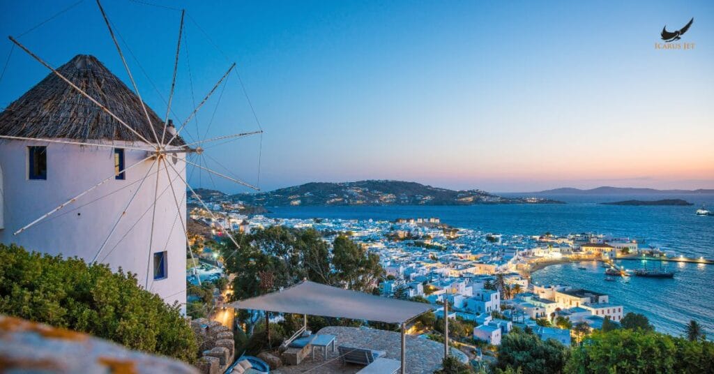 Mykonos Airport (JMK / LGMK): white windmill overlooking Mykonos town and the blue sea