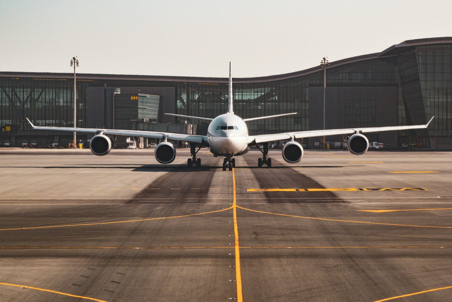 Dubendorf Air Base (LSMD): aircraft taxiing head on along the centreline with the terminal behind